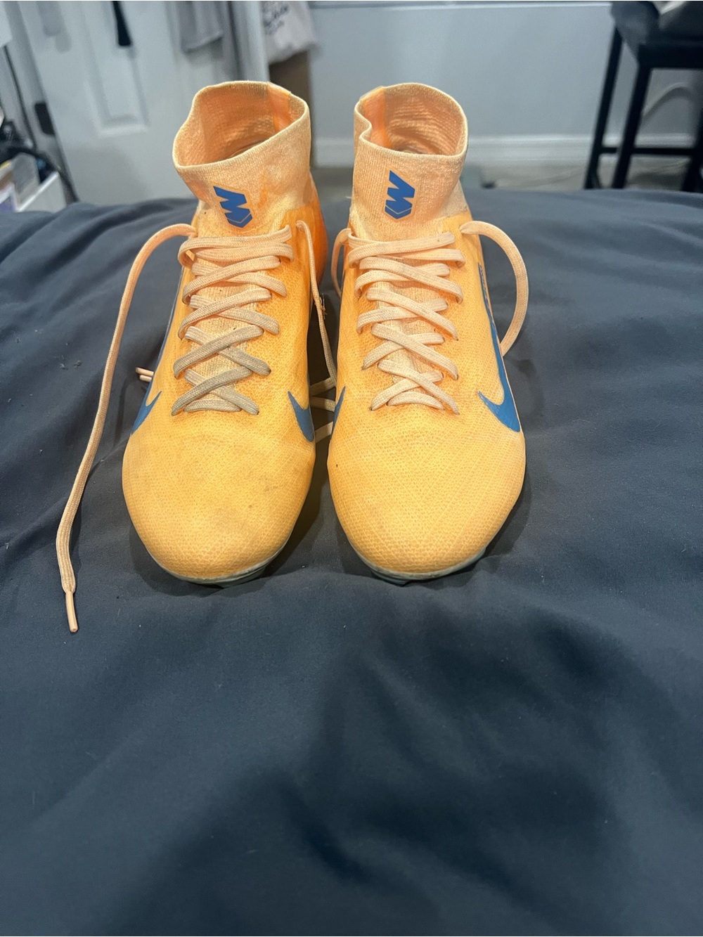 Nike Kids Orange High-Top Soccer Shoes with Blue Swoosh